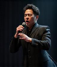 Ethan Chen performing on stage