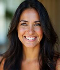 Marie Singh smiling in commercial scene